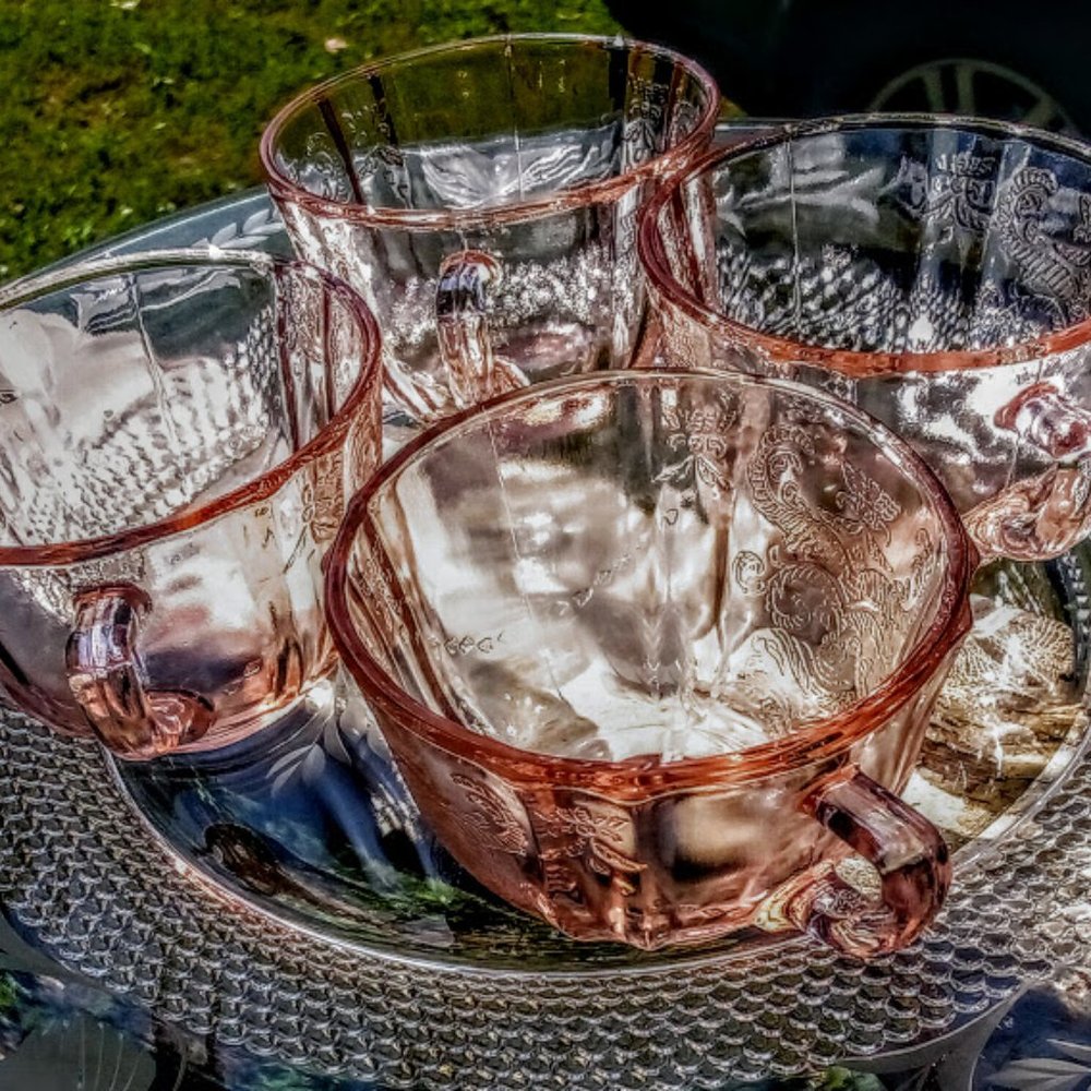 Set of four pink depression glass cups